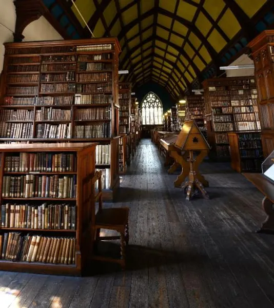 Interior of Ushaw College Library, featuring leather bound books on bookcases